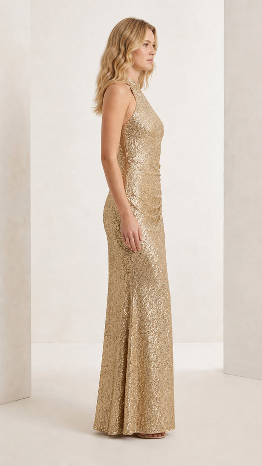 Side full-length view of the champagne gold sequin maxi dress showing slim fit and silhouette