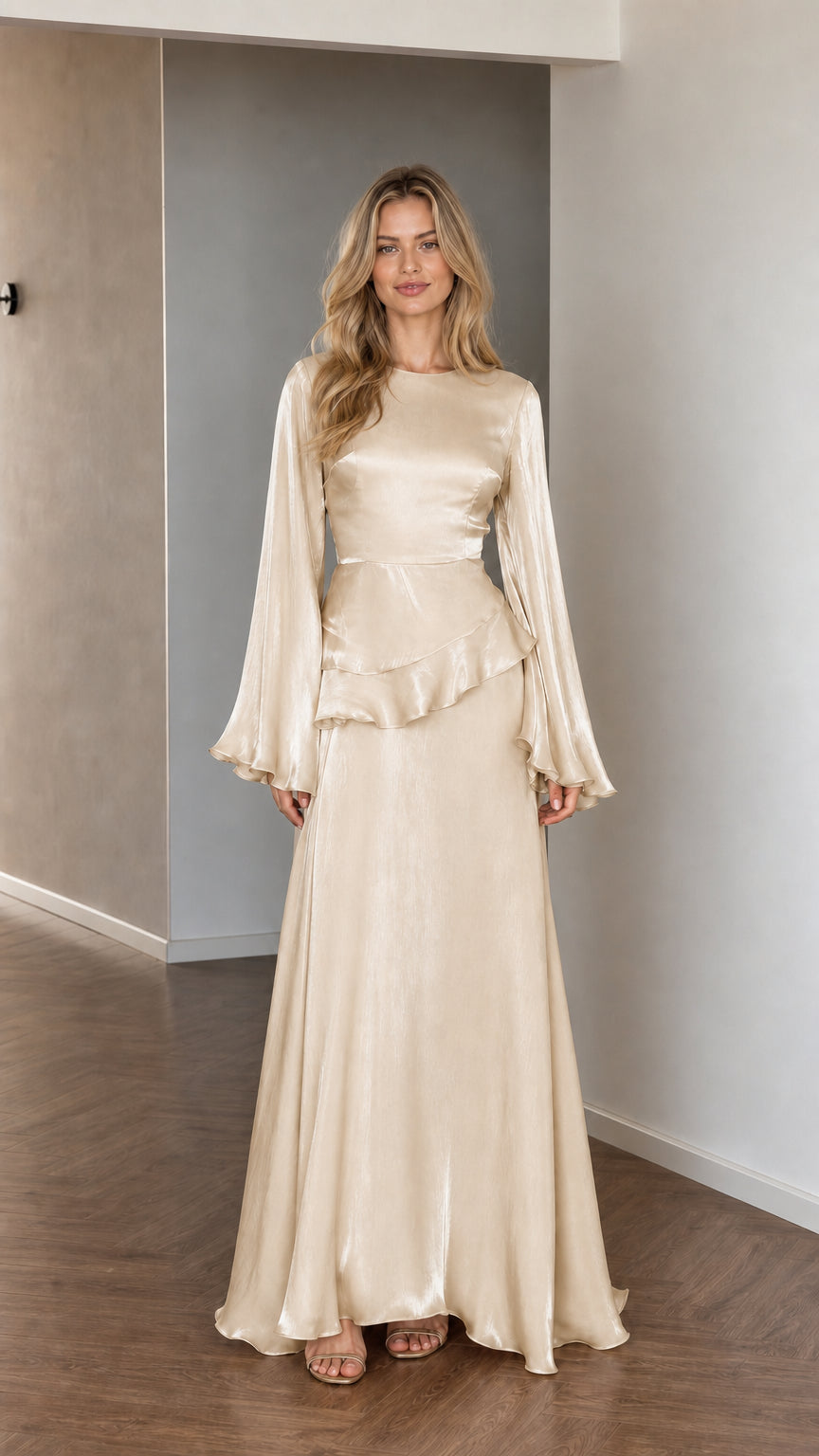 Front view of model wearing champagne satin long sleeve maxi dress