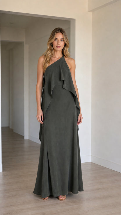 Full front view of a model wearing a charcoal grey one-shoulder cascading ruffle maxi dress