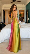 Back view of multicolor gradient halter backless maxi dress with flowing floor-length skirt