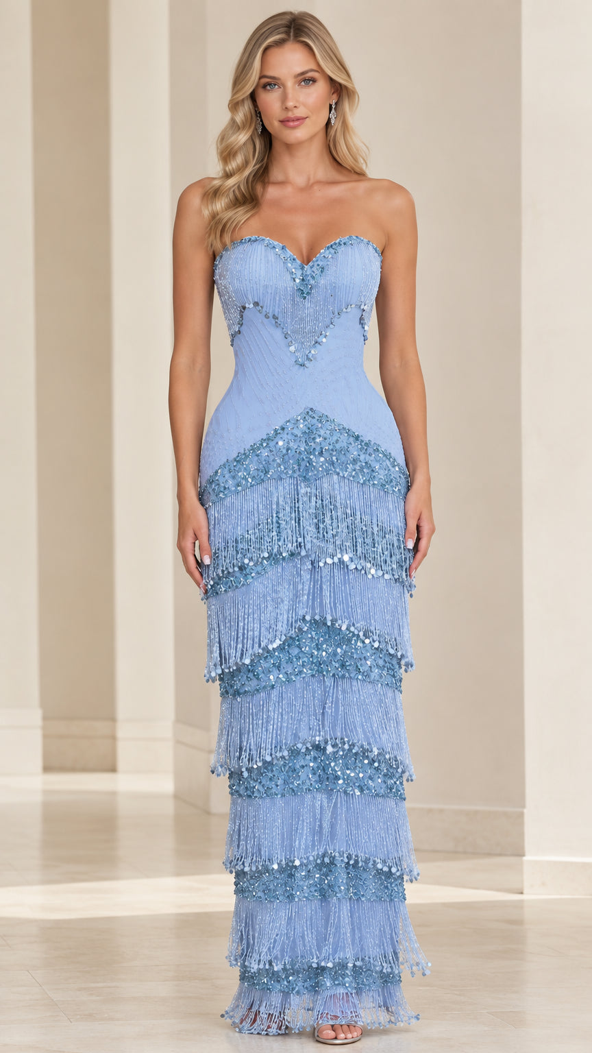 Front view of woman wearing sky blue strapless sweetheart beaded tiered fringe maxi dress