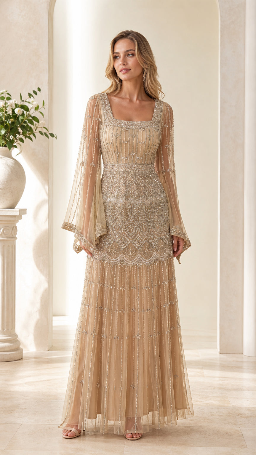 Front view of model wearing Champagne beaded evening gown with flare sleeves