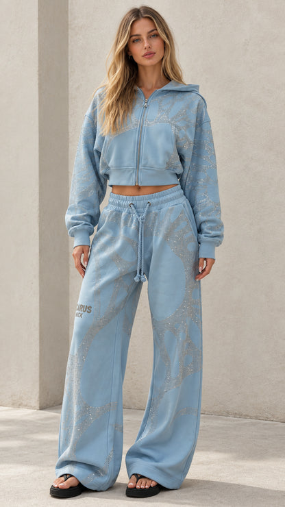 Front view of woman wearing Light Blue rhinestone cropped zip hoodie and wide leg sweatpants set