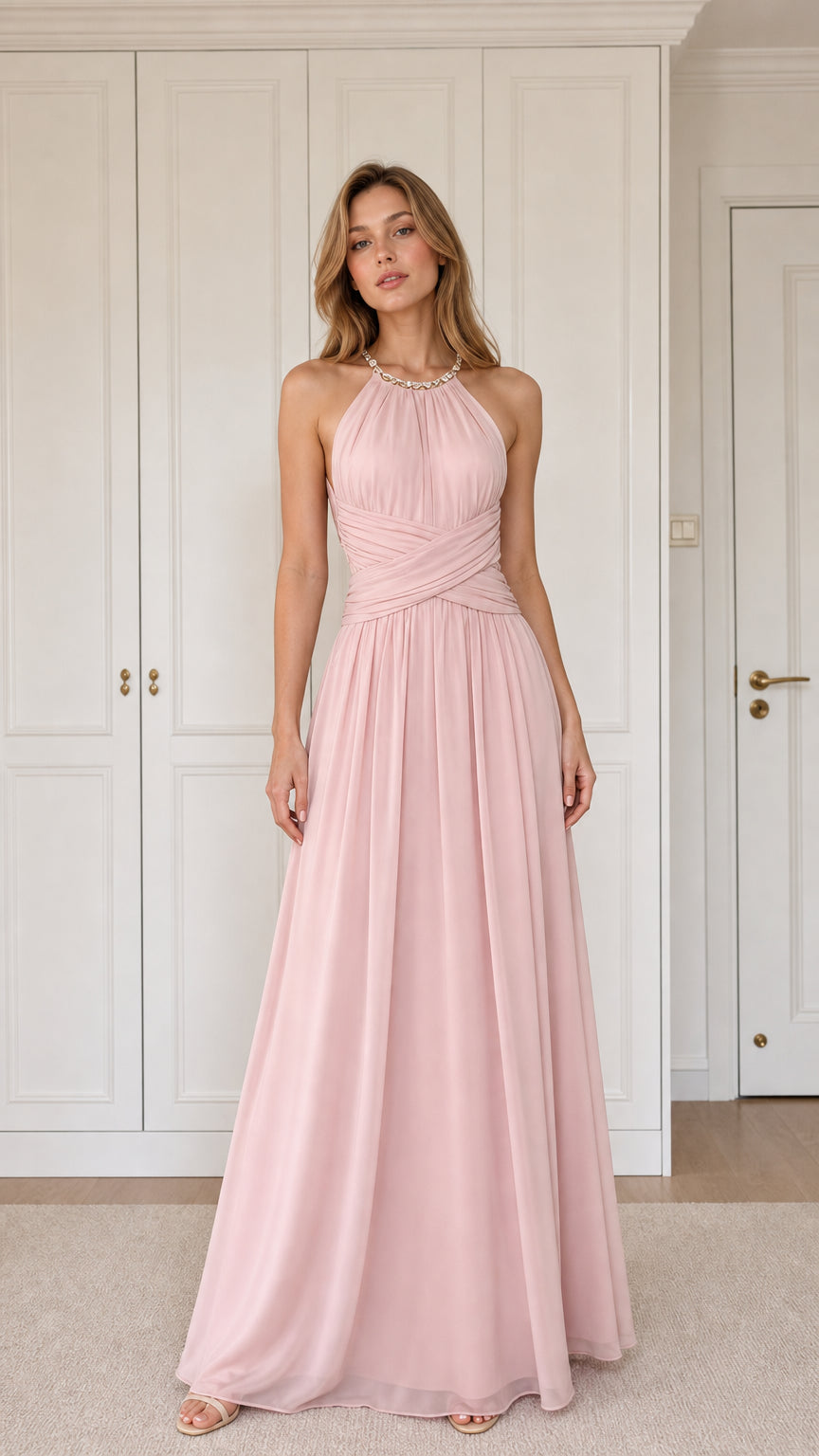 Front view of woman wearing blush pink halter pleated chiffon maxi dress