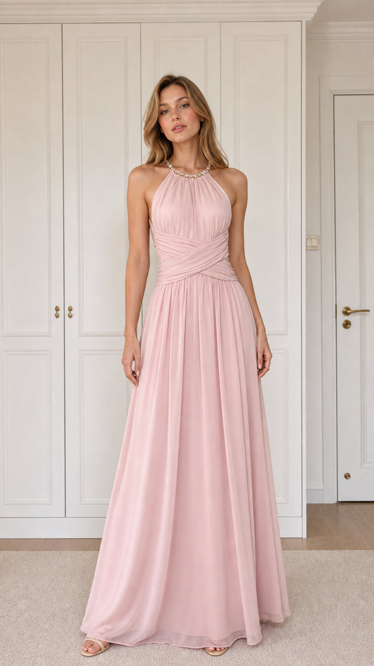 Front view of woman wearing blush pink halter pleated chiffon maxi dress