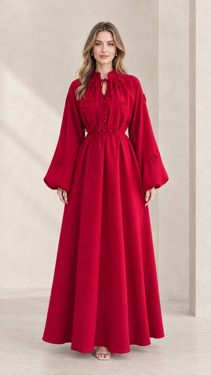 Front view of model wearing a crimson red embroidered lantern sleeve maxi dress