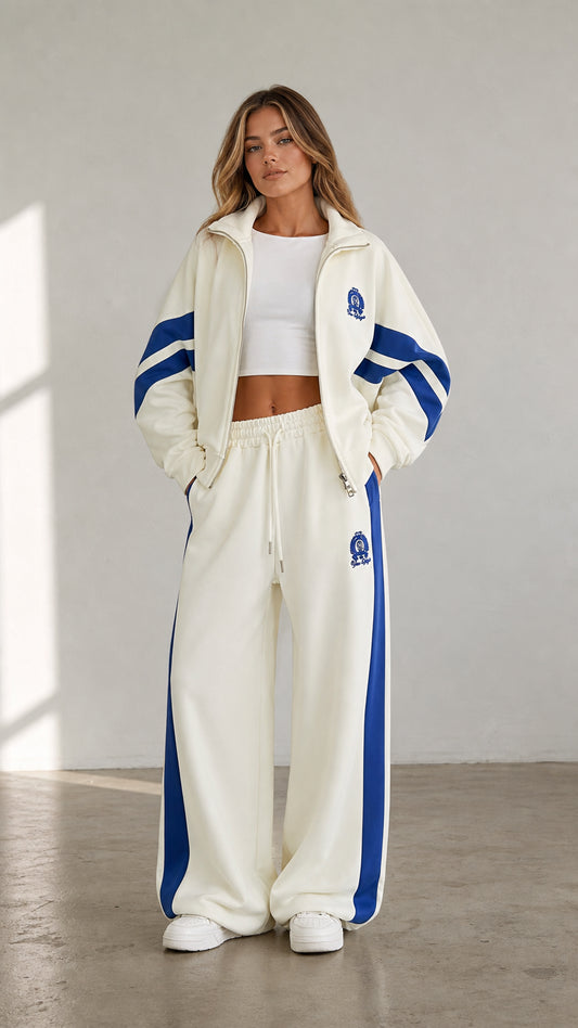 Women's cream two-piece tracksuit set with blue stripe accents front view