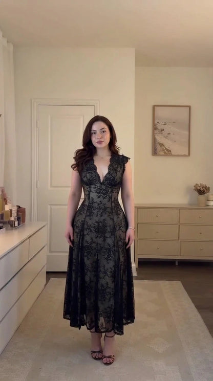 Front full-length view of model wearing black floral lace corset midi dress