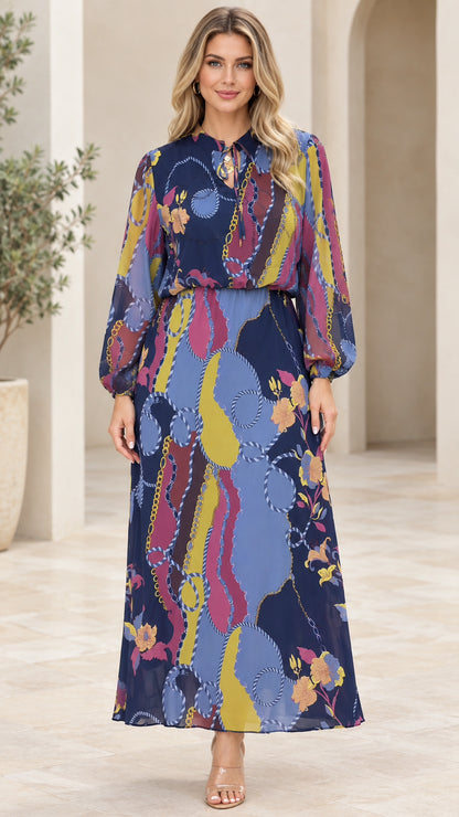Front view of model wearing Navy Blue chain print tie-neck maxi dress