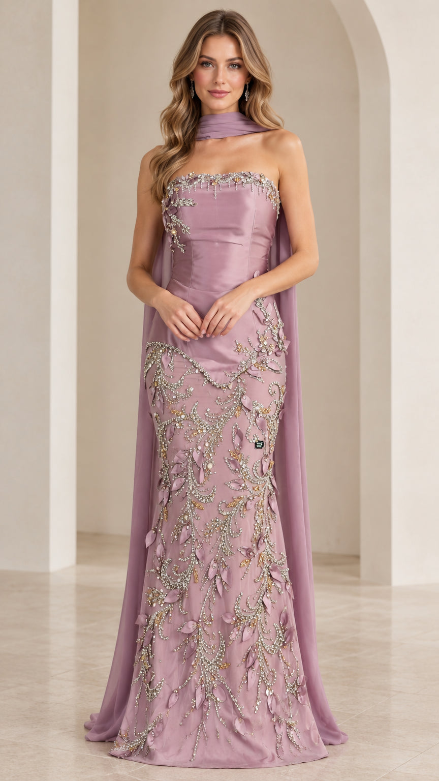 Front view of model wearing mauve strapless beaded mermaid evening gown with neck scarf cape