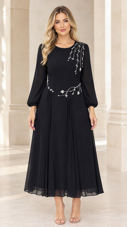 Front view of black long sleeve chiffon midi dress with rhinestone floral embellishments