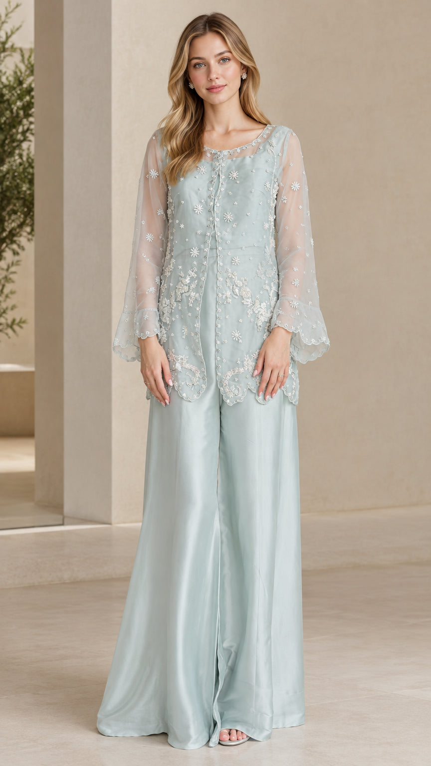 Front view of model wearing Light Blue embroidered sheer sleeve tunic and wide leg pants evening set