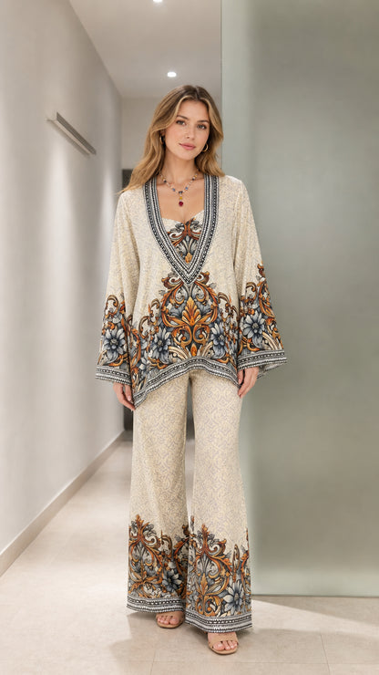 Front full-length view of model wearing cream vintage baroque floral tunic and wide leg pants set