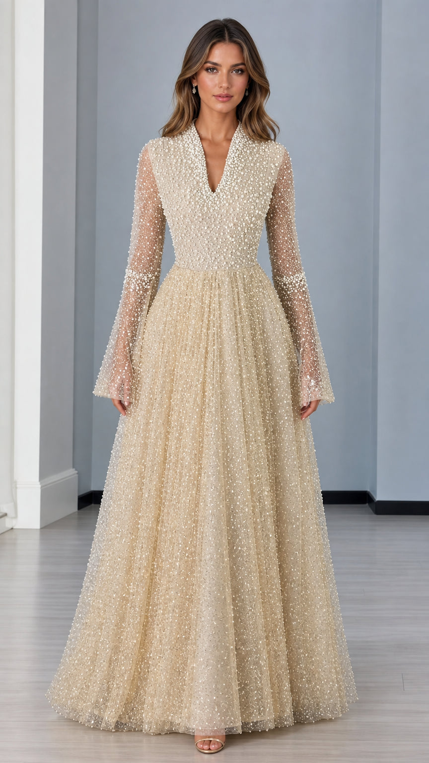 Front view of champagne pearl-embellished long sleeve evening gown