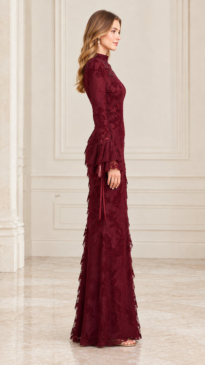 Side view of woman wearing burgundy floral lace long evening gown