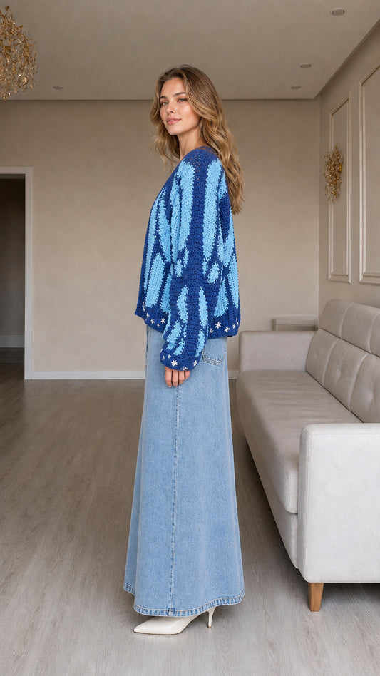 Side profile of model wearing blue butterfly open front cardigan sweater