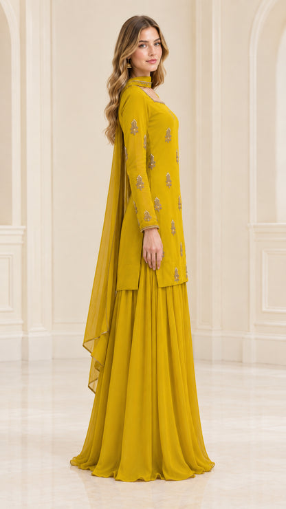 Side profile of model in mustard yellow ethnic sharara suit set