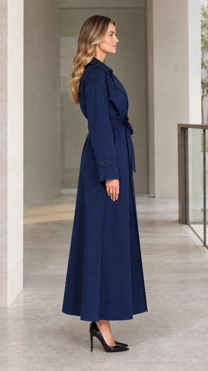 Side profile view of model wearing Navy Blue maxi trench coat with tie belt