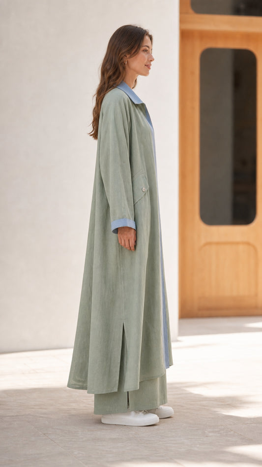 Side profile of sage green two-piece modest set showing relaxed drape and side slit detail