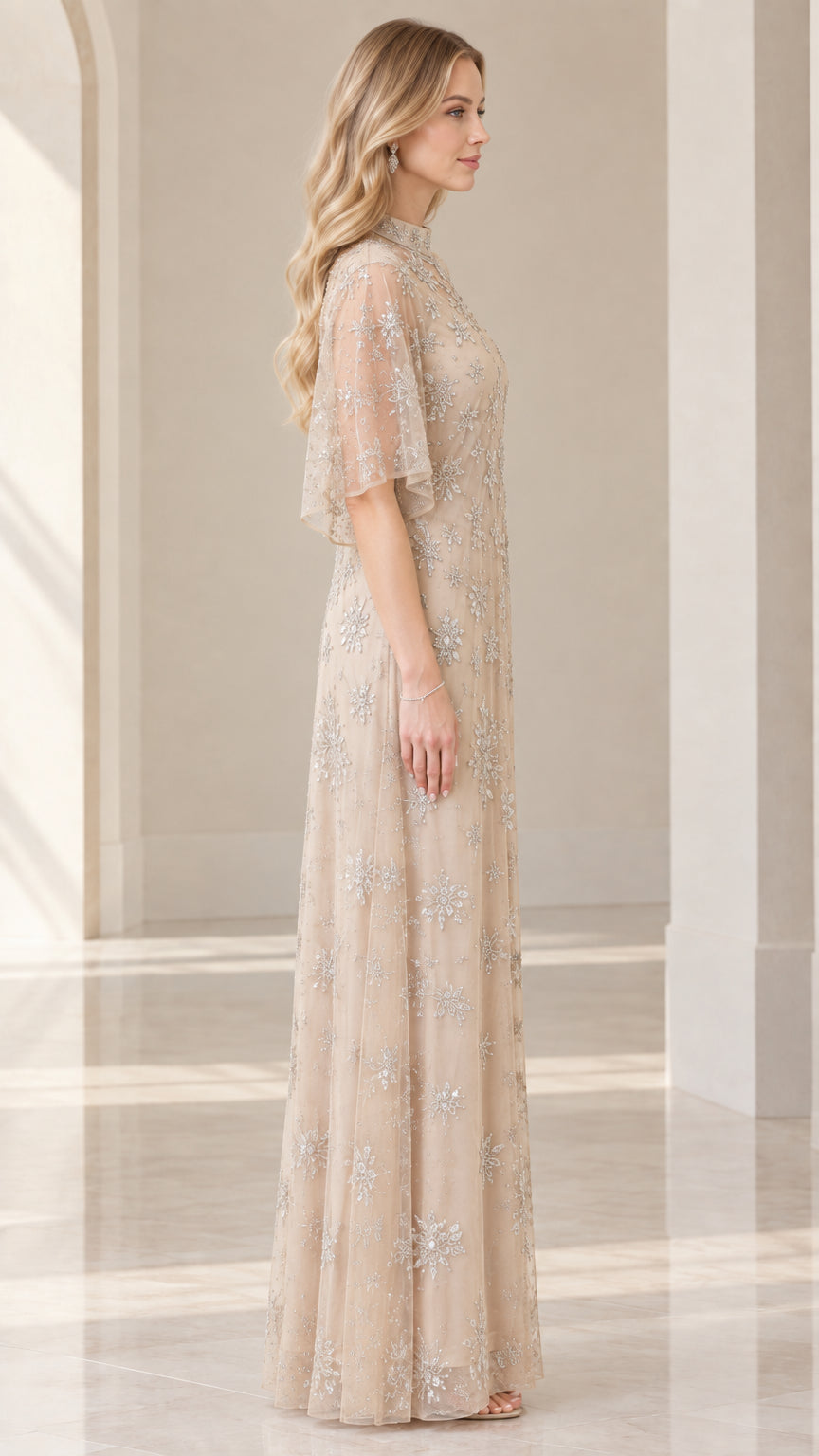 Side profile of woman in champagne embellished evening gown