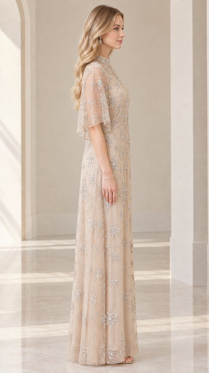 Side profile of woman in champagne embellished evening gown