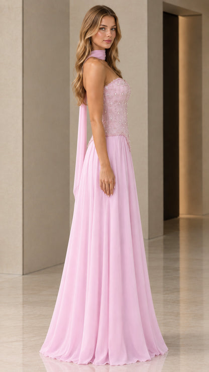 Side angle view of model in pink strapless chiffon formal dress