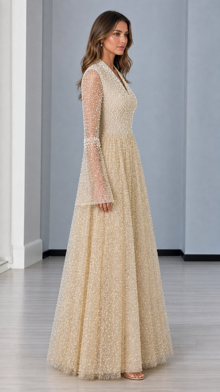 Side profile view of champagne pearl-embellished formal maxi dress