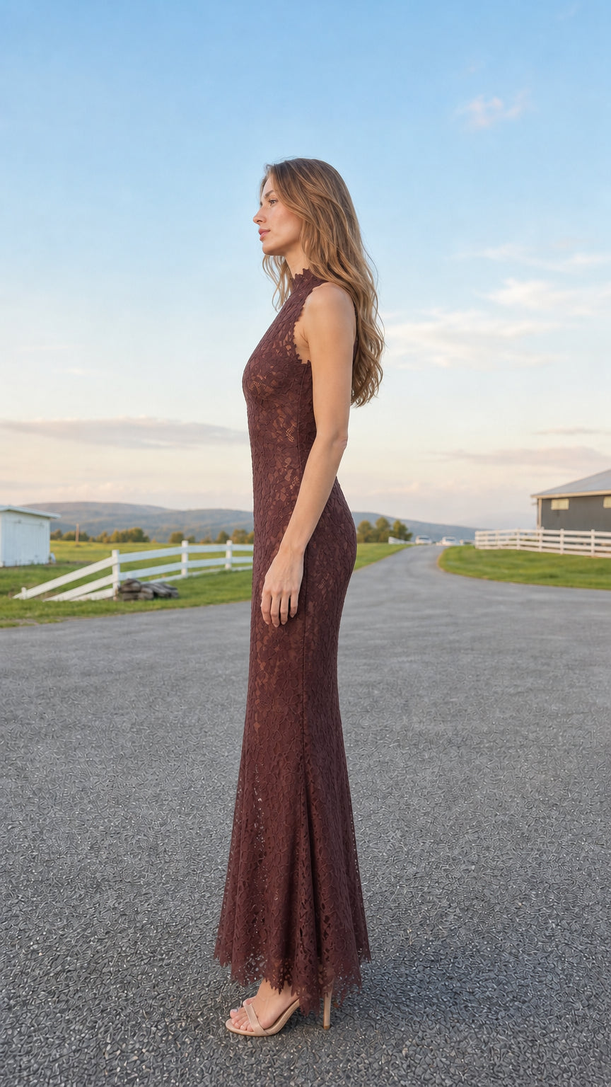 Side profile of model wearing burgundy sleeveless lace evening gown