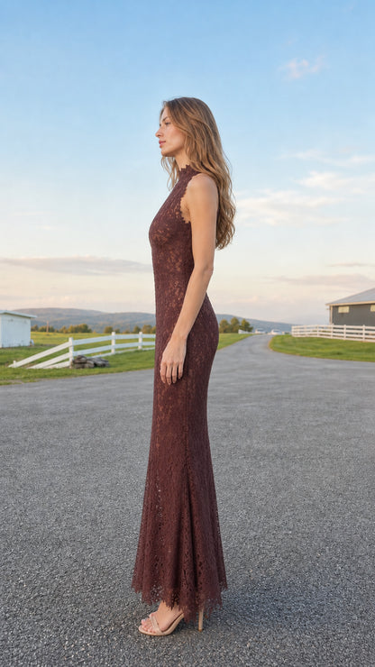 Side profile of model wearing burgundy sleeveless lace evening gown