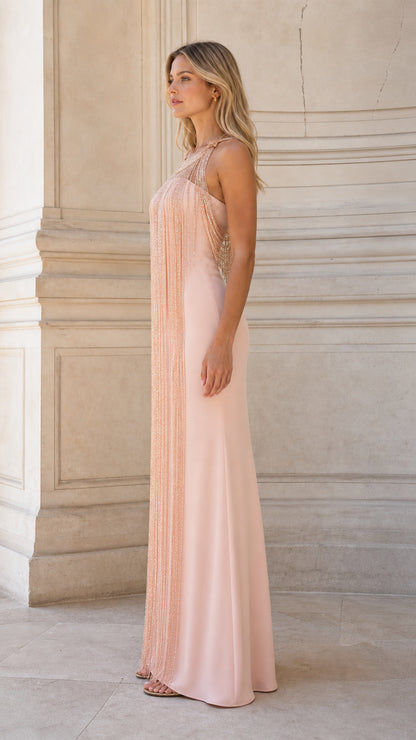 Side profile of model wearing Blush Pink floor-length beaded evening dress