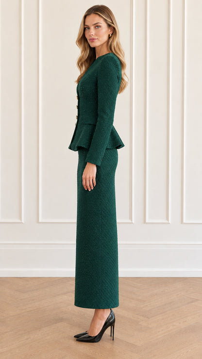 Side profile of model wearing emerald green tweed peplum skirt suit