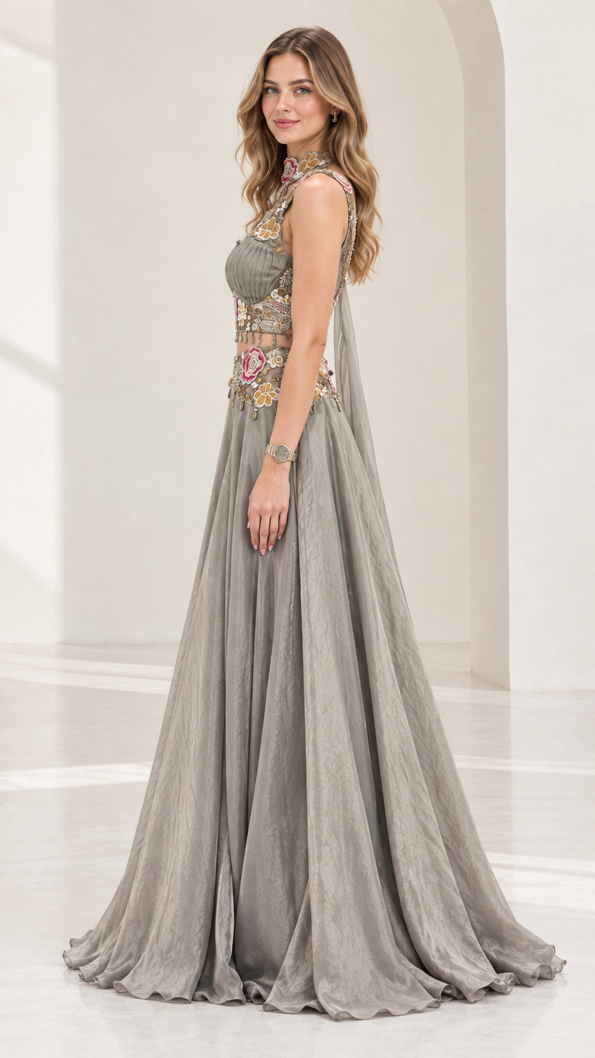 Side profile of silver grey two-piece formal dress with capelet drape