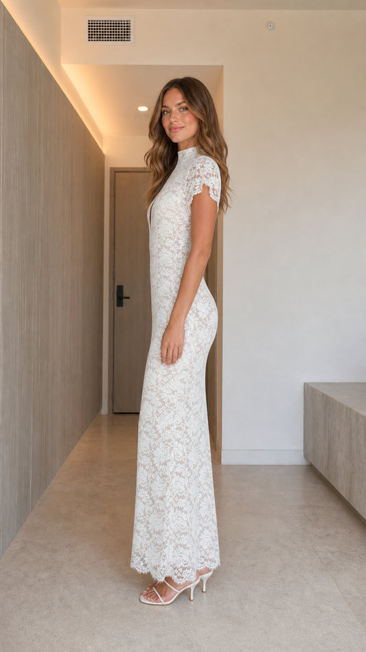 Side view of woman in slim fit white floral lace cap sleeve evening dress