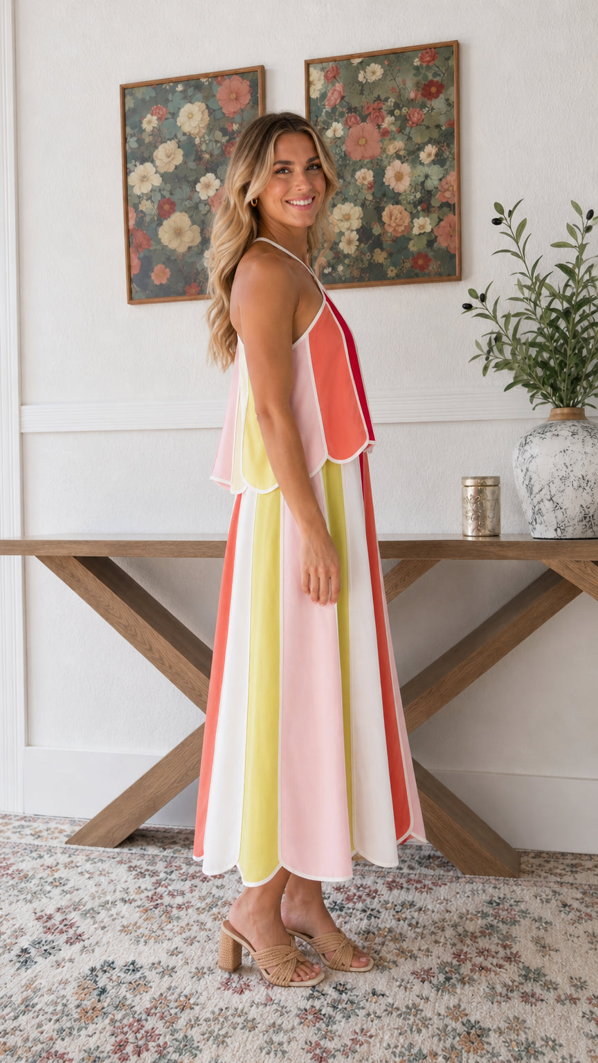 Side profile view of woman modeling Rainbow Multi tiered midi dress