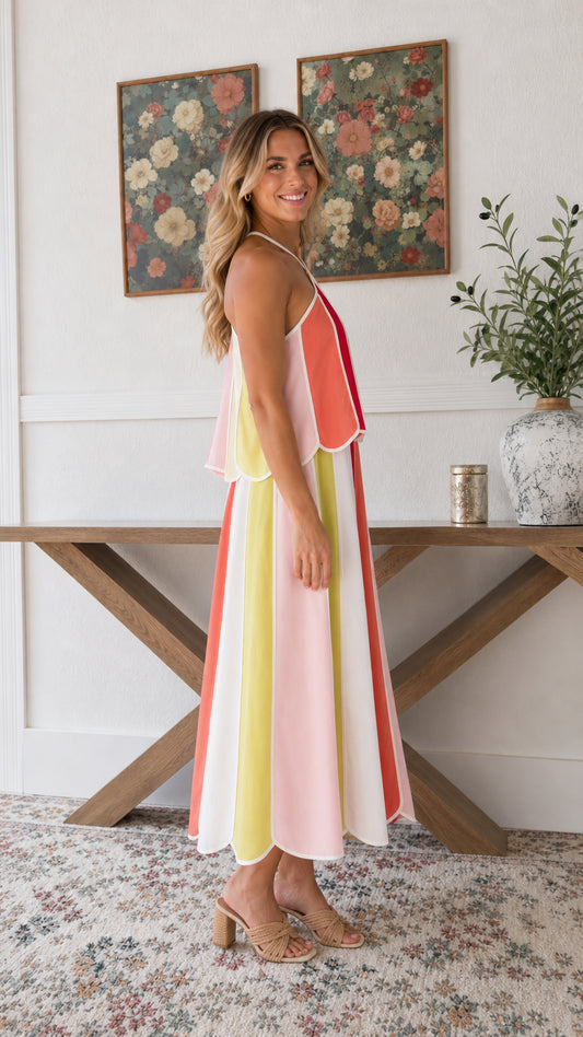 Side profile view of woman modeling Rainbow Multi tiered midi dress