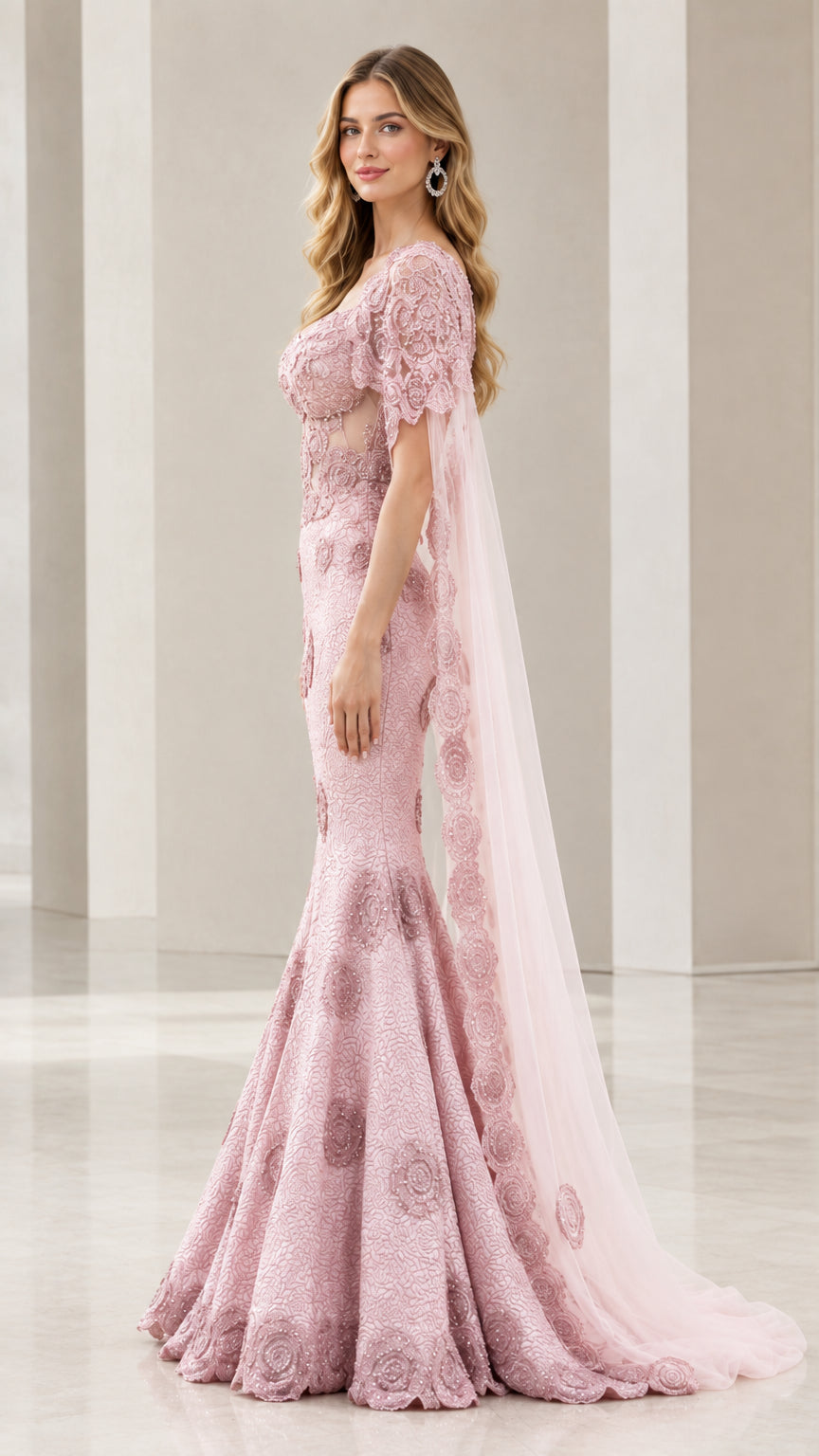 Side profile of dusty rose mermaid formal gown with flowing train and cape