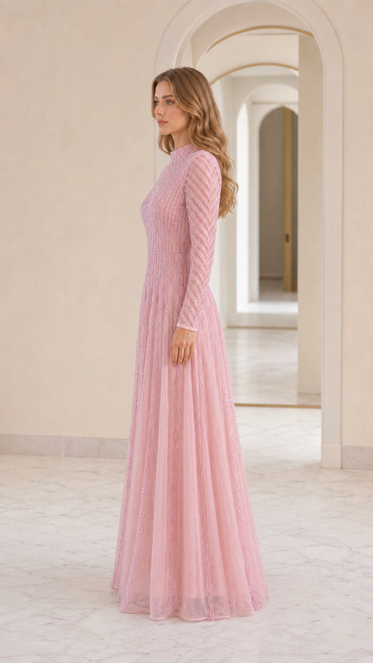 Side profile of model in pink sequin maxi dress
