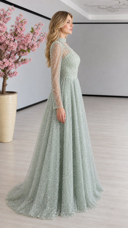 Side profile view of sage green beaded illusion sleeve formal gown
