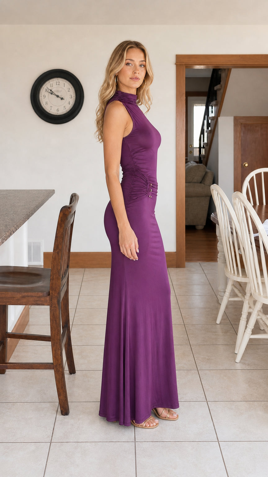 Side profile view of purple sleeveless high neck maxi dress showing silhouette