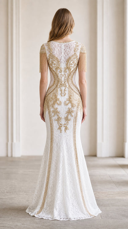 Back view of white lace evening dress showcasing intricate gold embroidery down the spine and skirt
