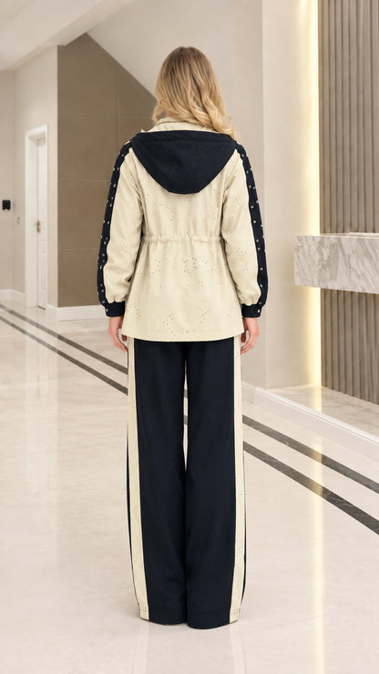 Back view of woman wearing Black colorblock hooded tracksuit set
