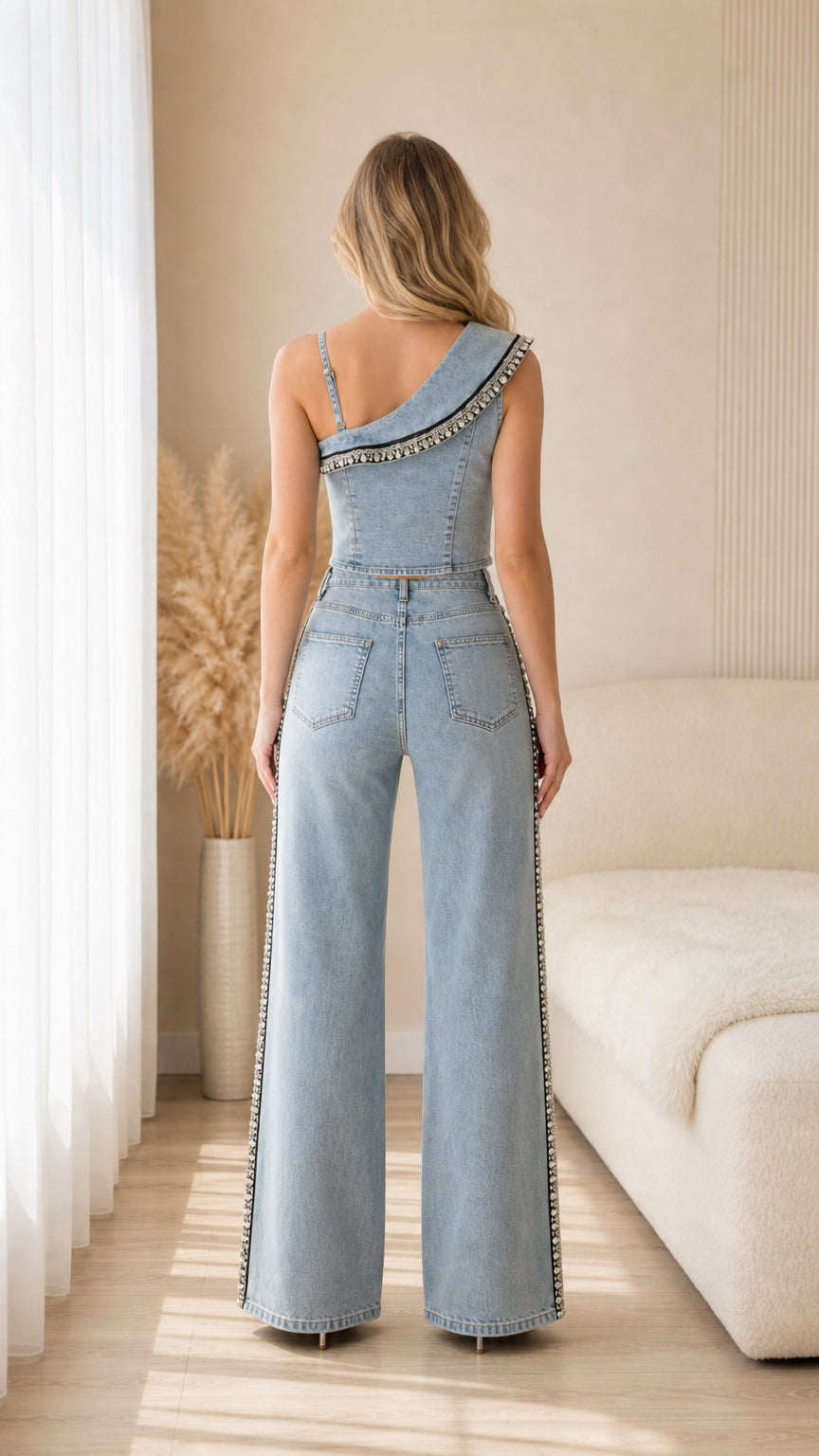 Back view of model wearing Light Blue denim wide leg pants and cropped vest set