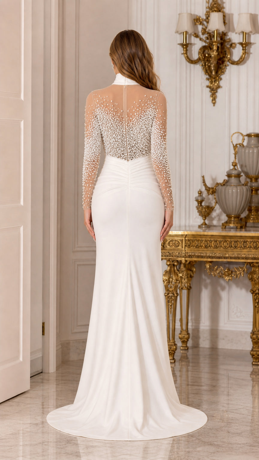 Back view of woman wearing white mock neck evening gown with sweep train