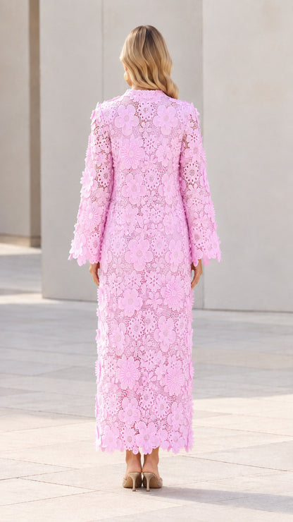 Back view of woman wearing Light Pink lace long sleeve column maxi gown
