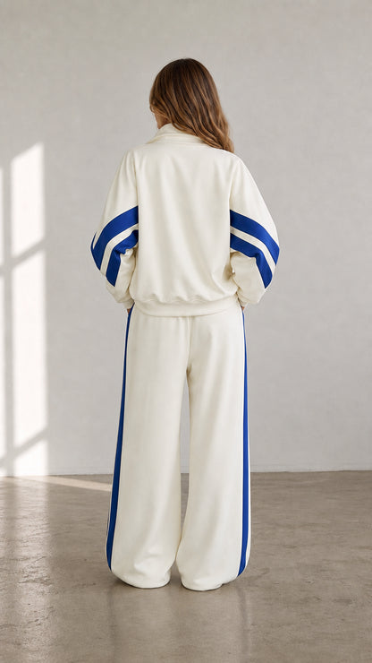 Back view of cream sporty track jacket and wide-leg sweatpants set