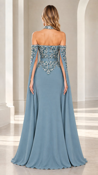 Back view of dusty blue halter evening gown showing dramatic cape drape