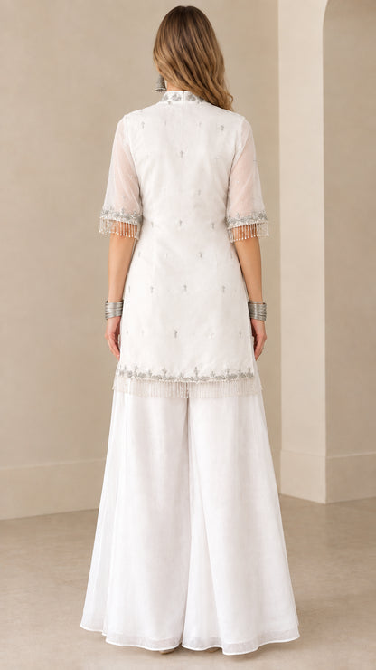 Back view of white embroidered kurti sharara suit set