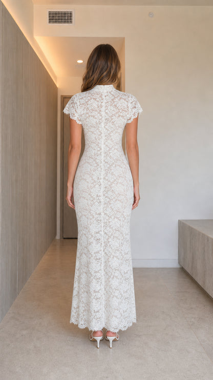 Back view of woman wearing white high neck lace column dress