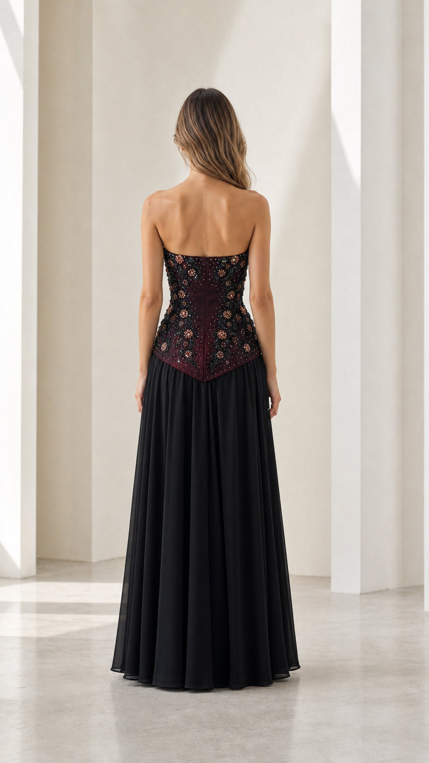 Back view of strapless burgundy evening gown showing beaded drop waist
