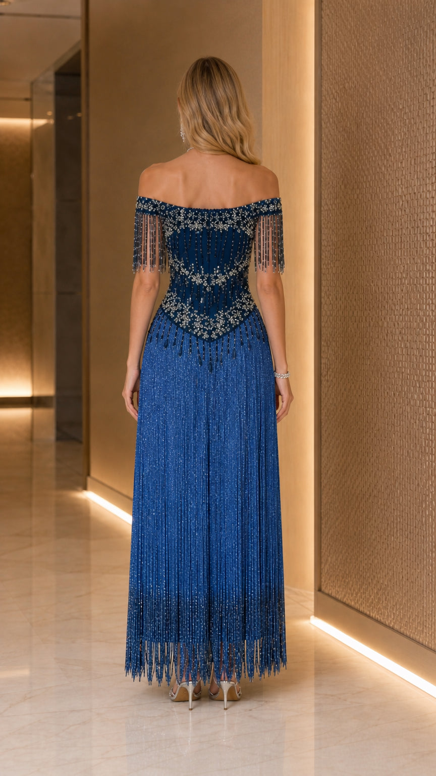 Back view of model in Royal Blue off-the-shoulder fringe evening dress
